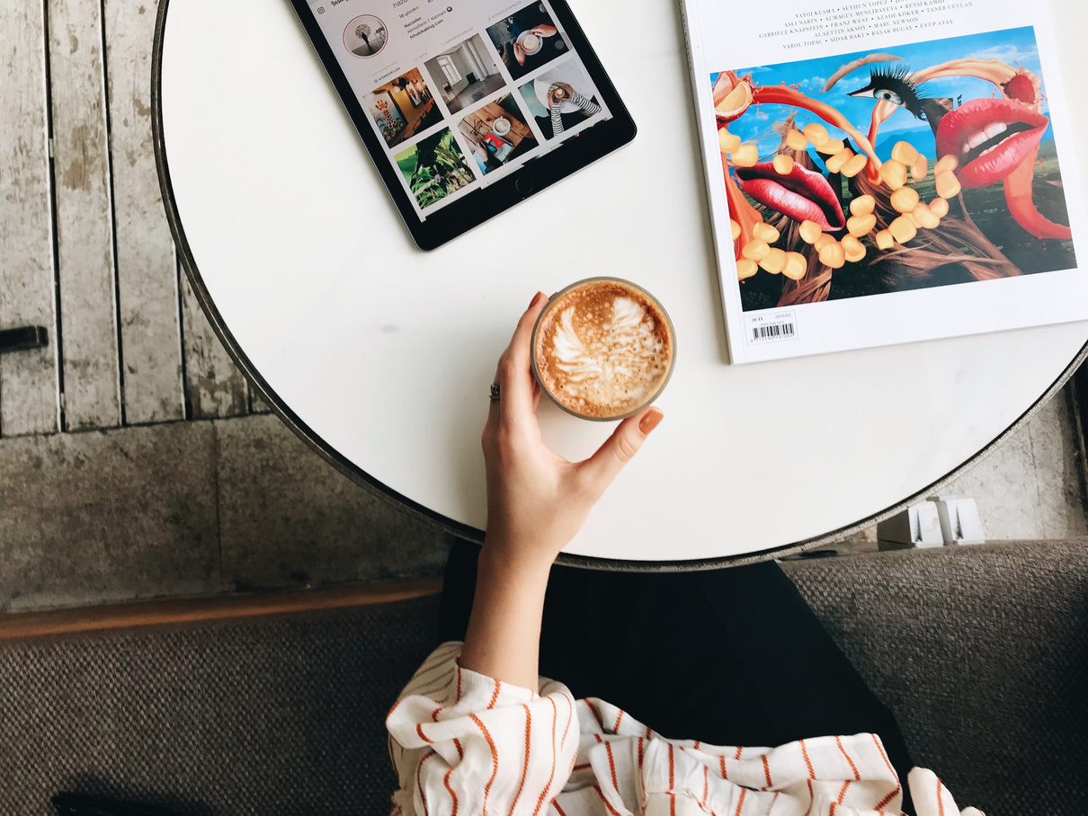 A Person Holding a Cup of Coffee